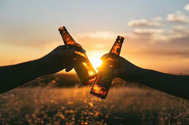 Picture of beer bottles 'cheersing' Picture of beer bottles 'cheersing'